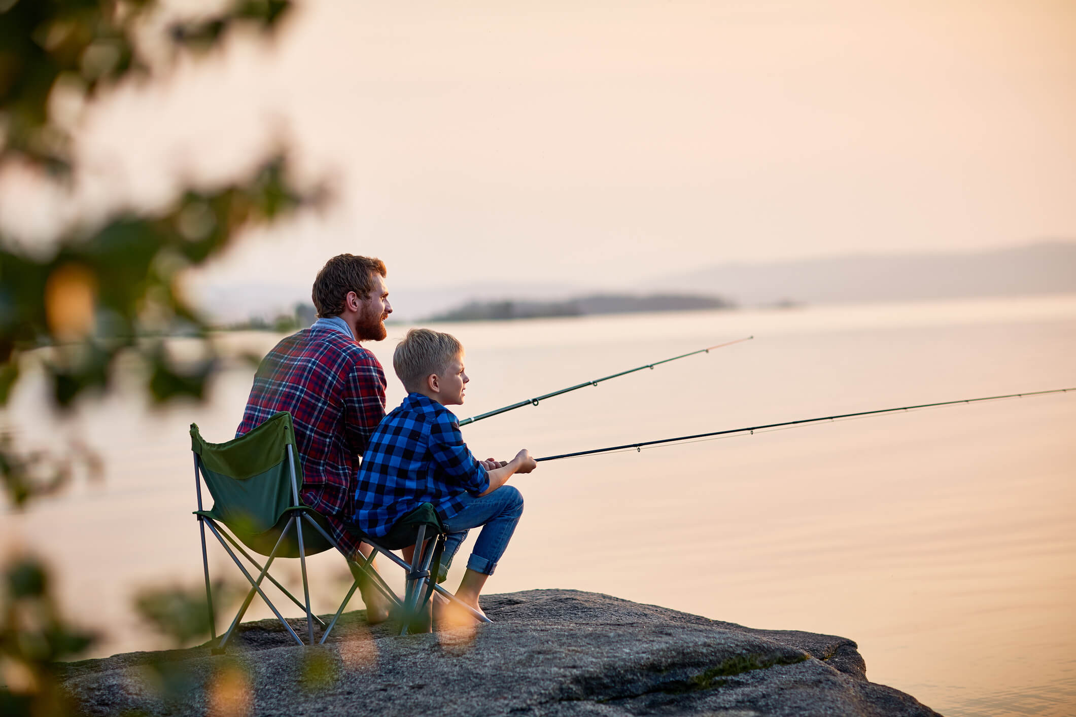 a father using a fishing rod he got as a gift on Father's Day