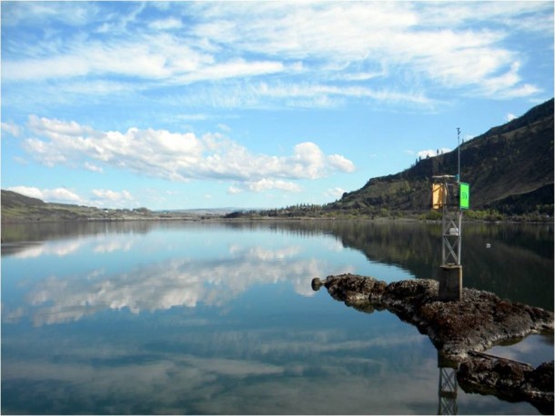 Tempest-WeatherFlow observation site with a weather sensor on the shore of the Columbia River Gorge