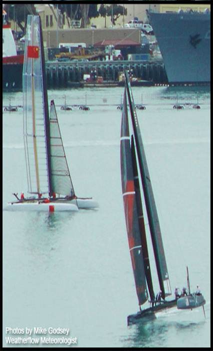Two wing-sailed catamarans on the ocean during America's Cup World Series in San Diego