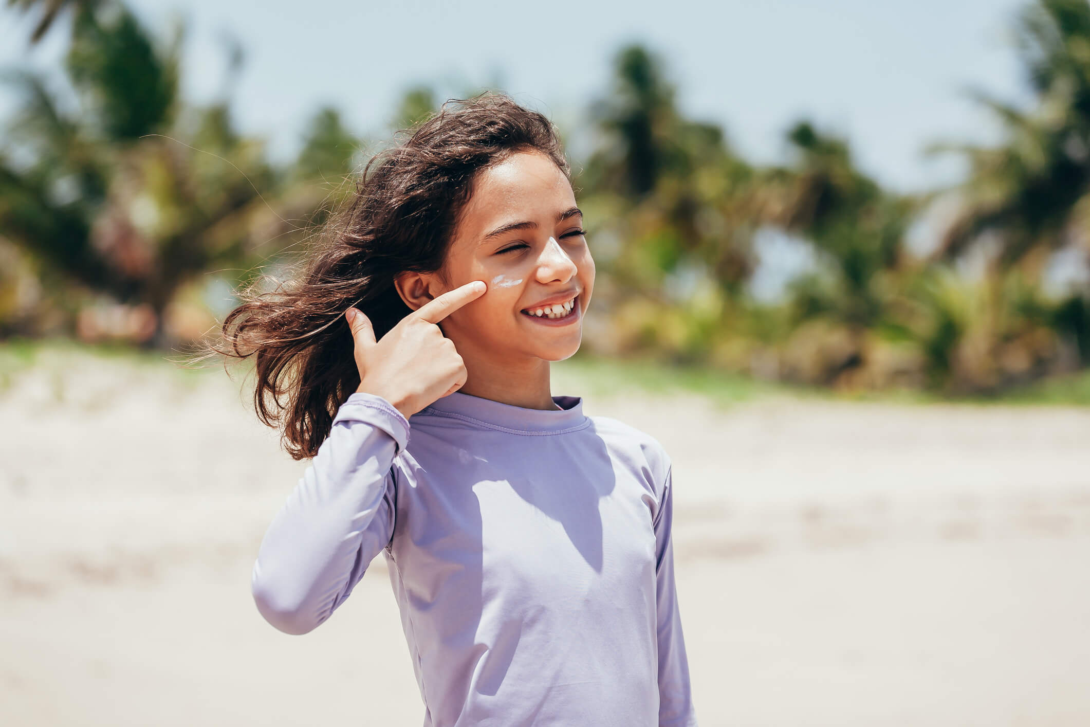 a kid wearing a lightweight UV protecting shirt on a hot day
