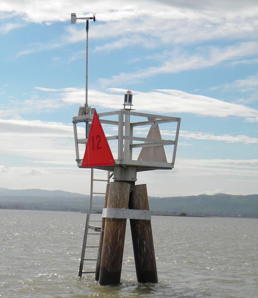 Sherman weather antenna sitting on a stand in the water