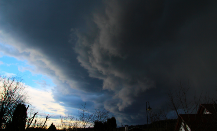 A cold front cloud formation lurking over a residential town