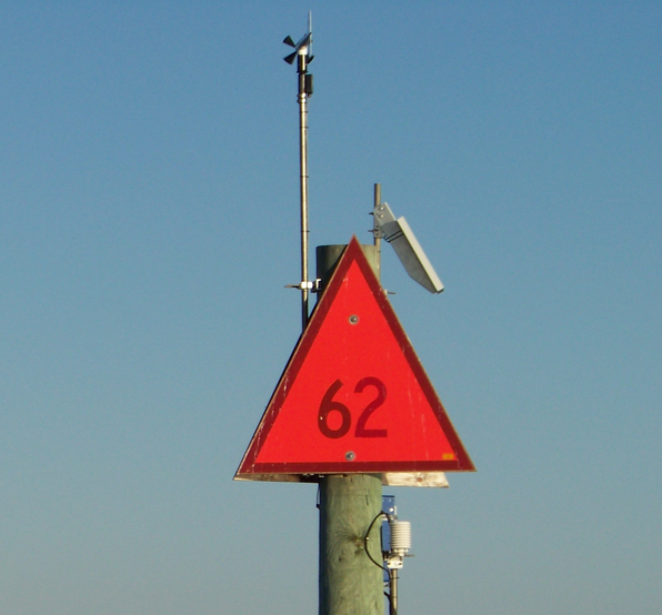 Grass Island weather antenna installed on top of a weather tower