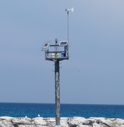 A weather station mounted on a pole in Leland Square