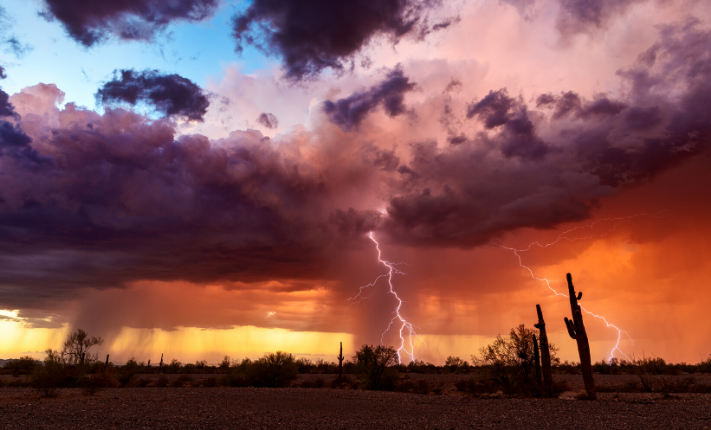 Severe weather in a field with storm clouds, rain, and lightning